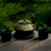 selective focus photography of gray teapot